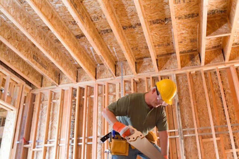 construction-worker-in-hard-hat-sawing-timber-on-b-2026-01-11-08-04-35-utc