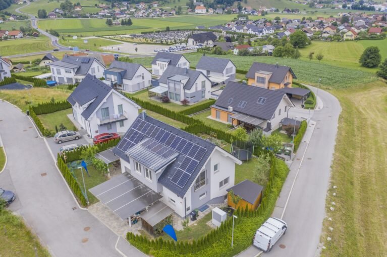 aerial-view-private-houses-with-solar-panels-roofs