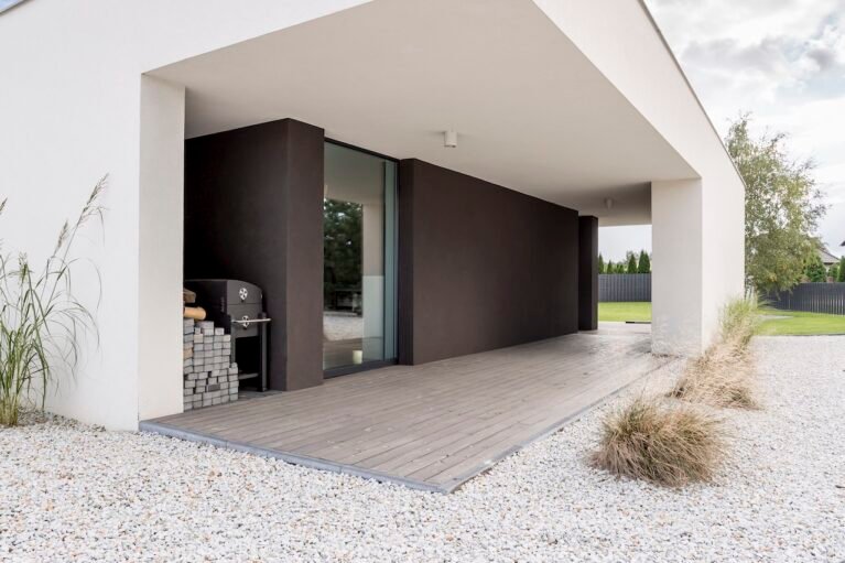 Backyard of modern, minimalistic house in daylight